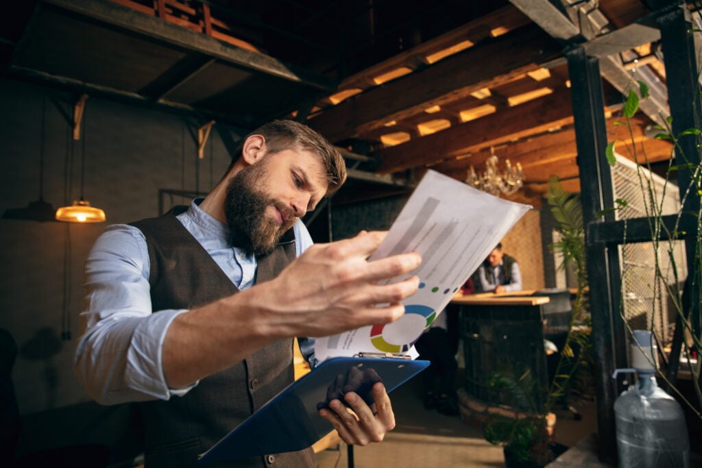 man looking at his companies financials