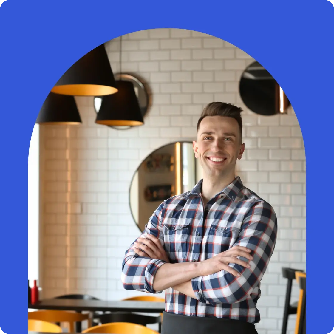 franchise owner standing in the main area of his restaurant