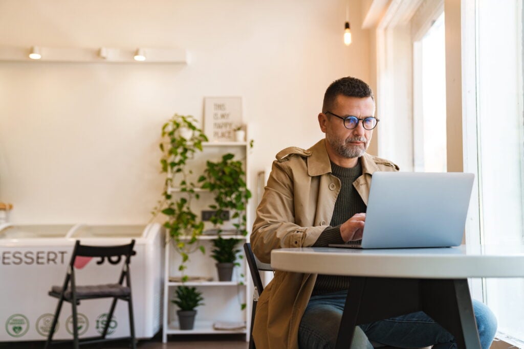 man in a cafe getting a small business loan