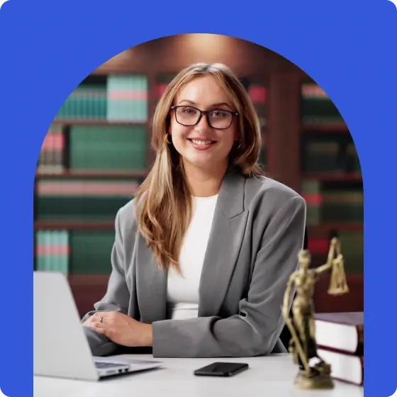 Professional services business owner sitting at their desk in their office