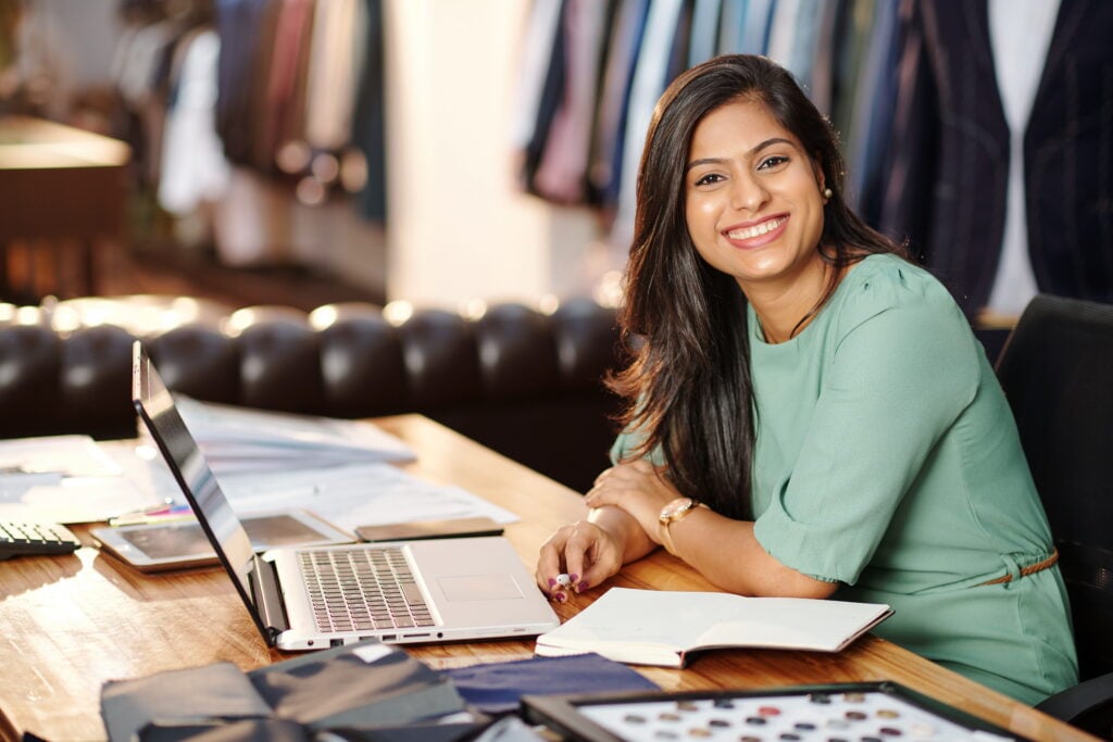 a small business owner happy that she chose bridgement