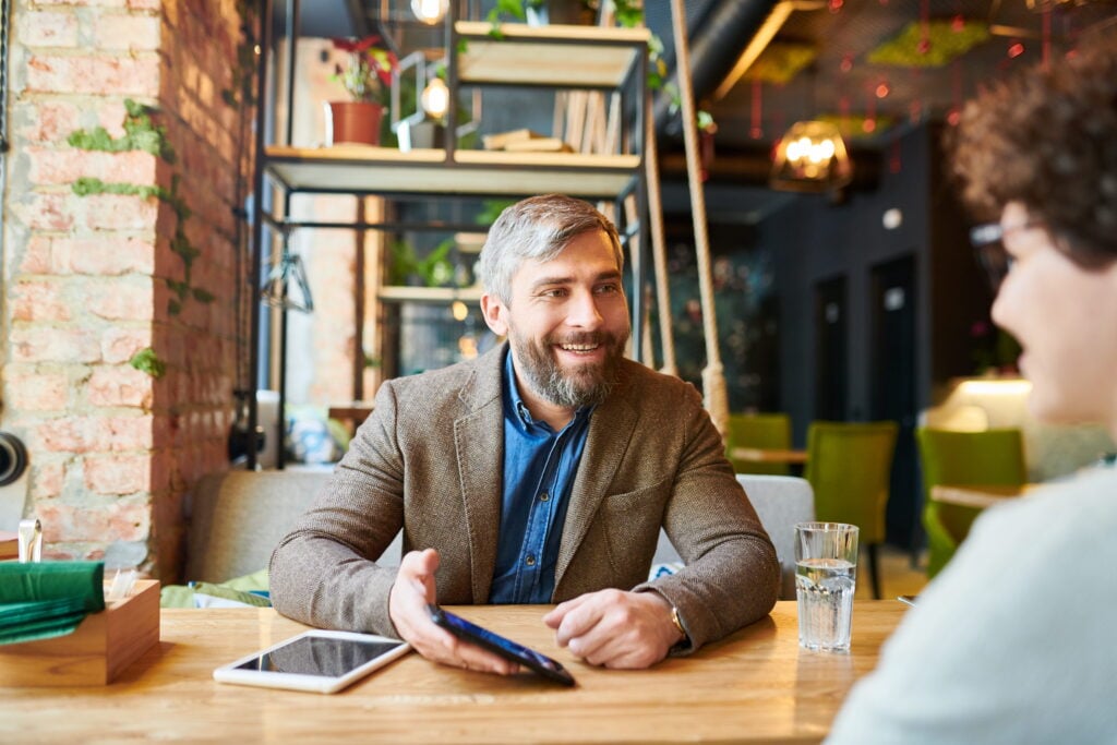 A business owner discusses working capital loan and invoice financing options with an advisor.